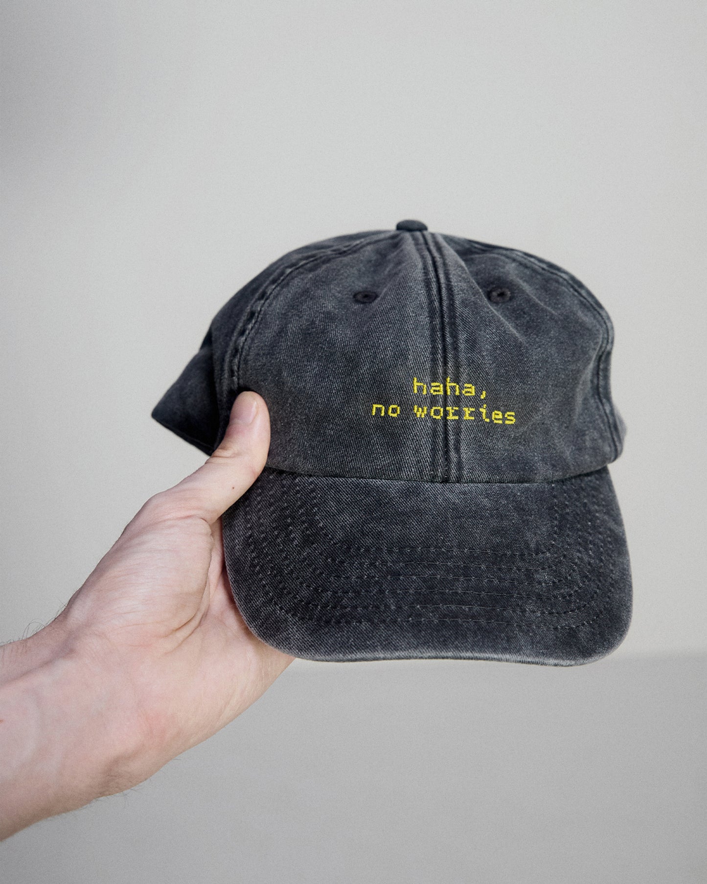 "haha, no worries" cap embroidered detail