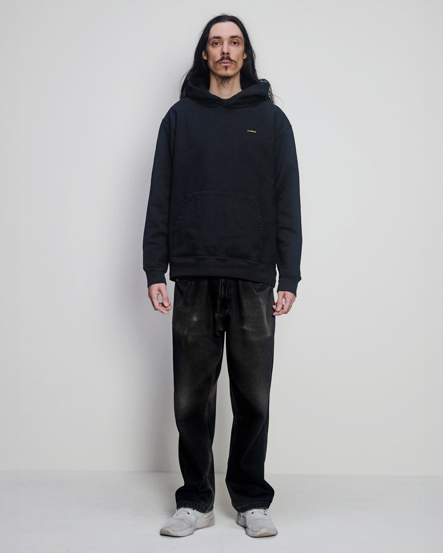 Lubalin modeling the "haha, no worries" Hoodie front
